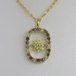 Colgante Muka Plata Dorada y Circonitas Marrones